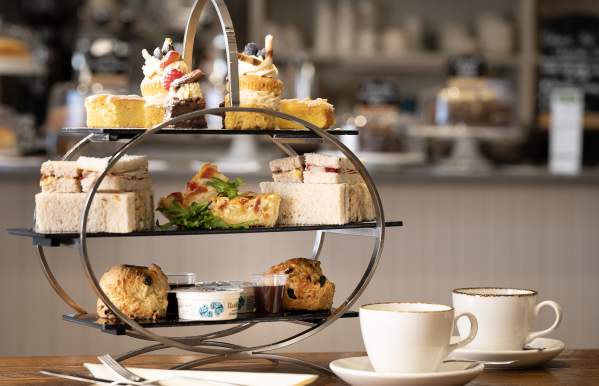 afternoon  tea  cakes  and  hot  drink  in  mug