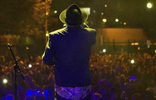view from a stage behind the performer looking over the crowd