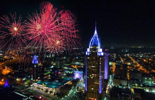 Downtown Mobile at night with fireworks in the sky