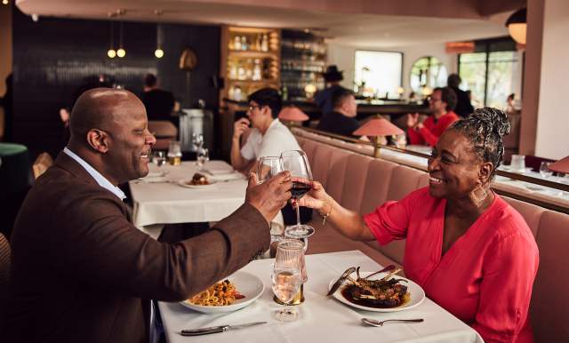 Couple toasting at dinner