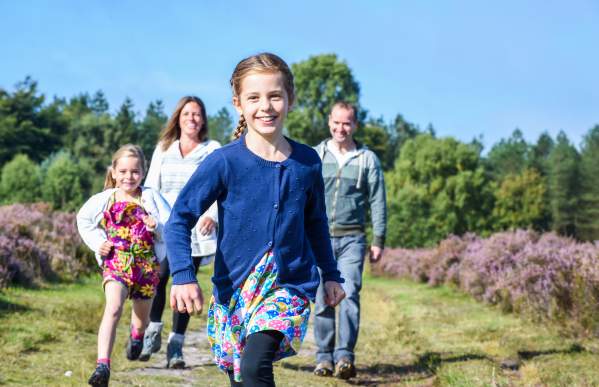 Cannock Chase heathland family walking girls running ahead