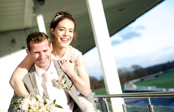 Uttoxeter Racecourse weddings Bride Groom piggyback