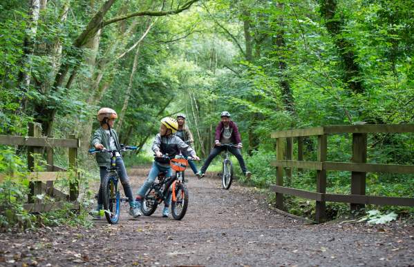 family cycling along Churnet Valley Way
