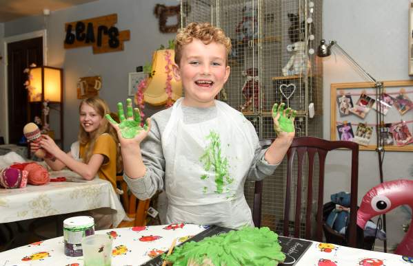 boy with green paint on hands