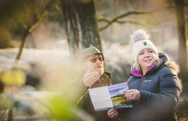 two  people  looking  at  leaflet