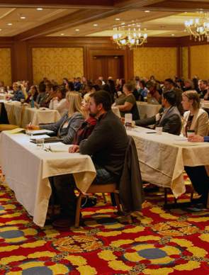 Conference attendees listening to a presentor
