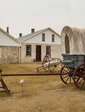Historic Fort Laramie with wagon and open grasslands in Goshen County, Wyoming.