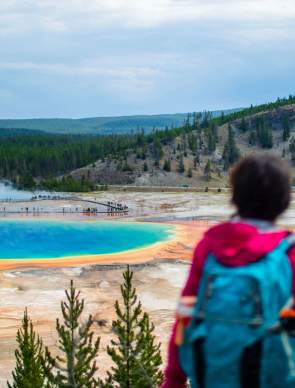 Expansive view of visitors viewing the Grand Prismatic spring in Yellowstone National Park.