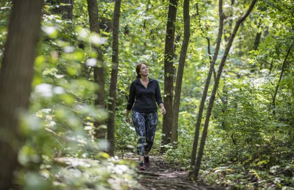 woman forest trail