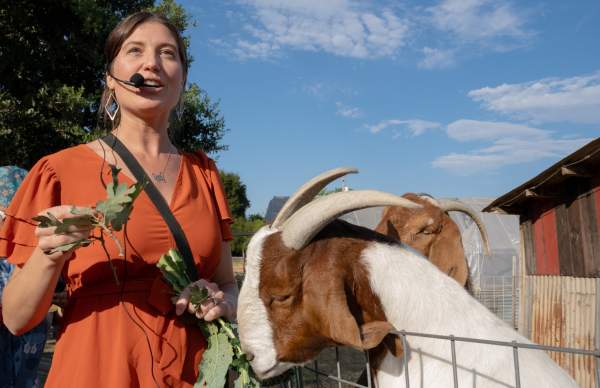 Woman teaching about goats
