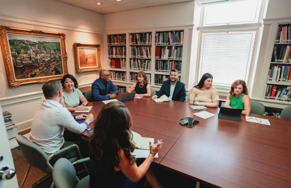 business meeting, sitting around large conference table
