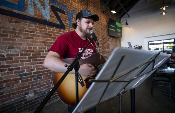 Man Playing guitar indoors