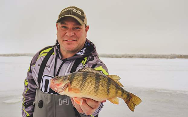 Fisherman holding Perch