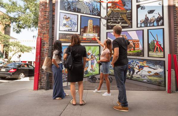 Group of professional looking at downtwon mural