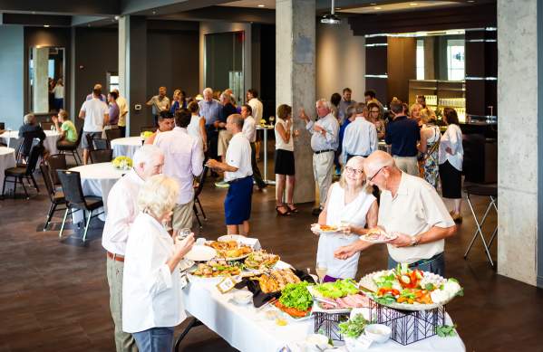 Group enjoying a reception at Zingerman's Greyline