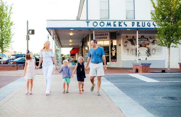 Family in fornt of Toomers Corner