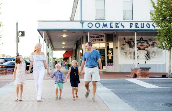 Family in fornt of Toomers Corner
