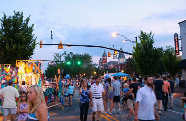 crowd shot of summernight downtown art walk with Samford Hall in background