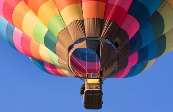 A multicoloured balloon in the sky over Bristol
