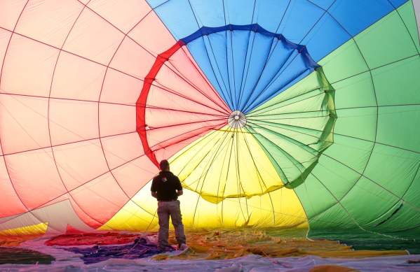 A balloon being inflated by an attendant at Bristol International Balloon Fiesta - credit Paul Box