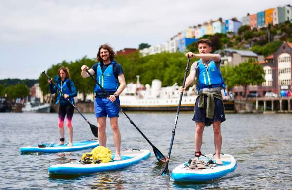 Group on paddelboards in Bristol harbour - credit SUP Bristol
