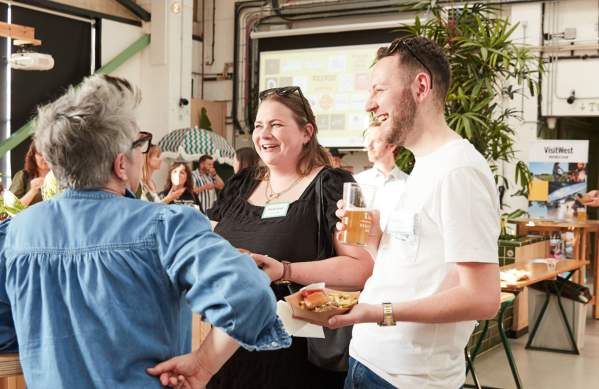 People talking at food and drink event - credit Charlotte Tolhurst