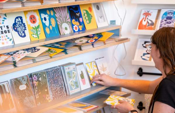 Person browsing at Fig 1 shop in Wapping Wharf - Credit Hey What