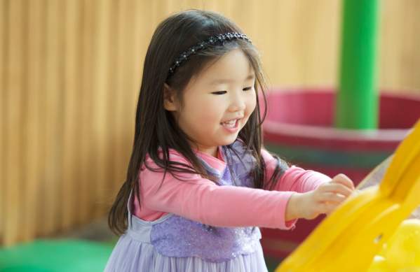 A child playing with an exhibit at the We The Curious in Bristol - credit Daniel Watkiss