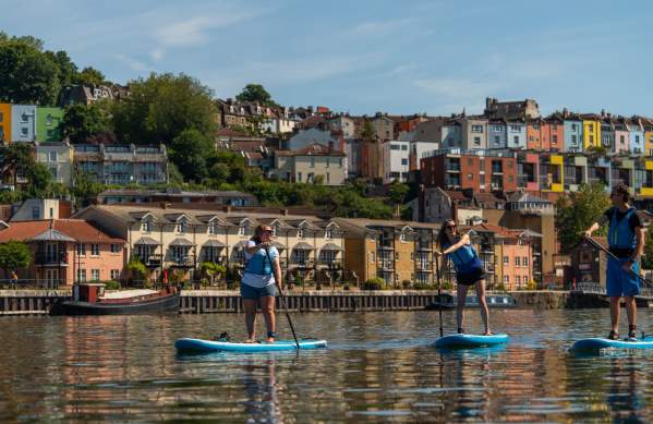 Paddleboarders in front of Hotwells on Bristol Harbourside - credit Visit West