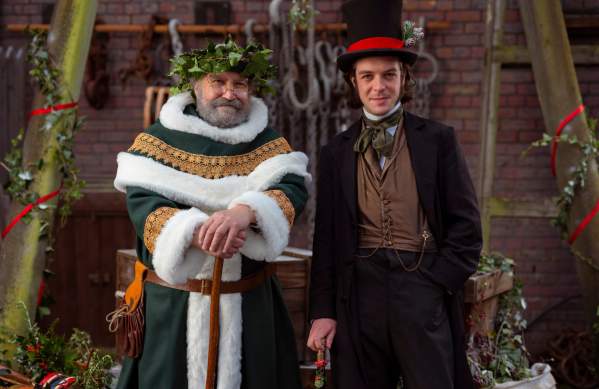 Father Christmas and Brunel stoods infront of a Christmas backdrop - Credit Brunel's SS Great Britain