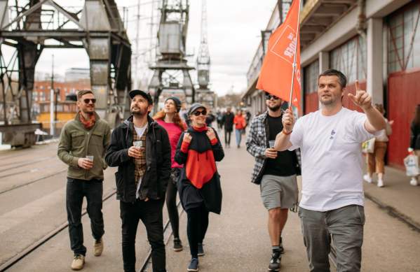 A group of people on the Cider Box walking tour of Bristol outside the M Shed local history museum on Bristol's Harbourside - credit Yuup