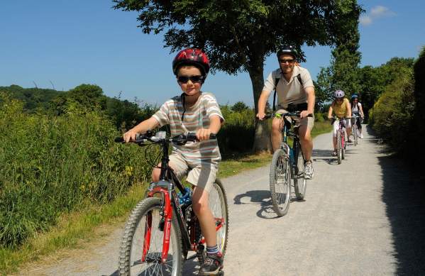 A family cycling on the Strawberry Line path near Bristol - credit Sustrans
