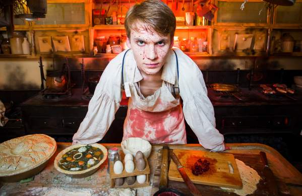 An actor dressed as a butcher covered in fake blood inside Brunel's SS Great Britain, Bristol - credit Adam Gasson