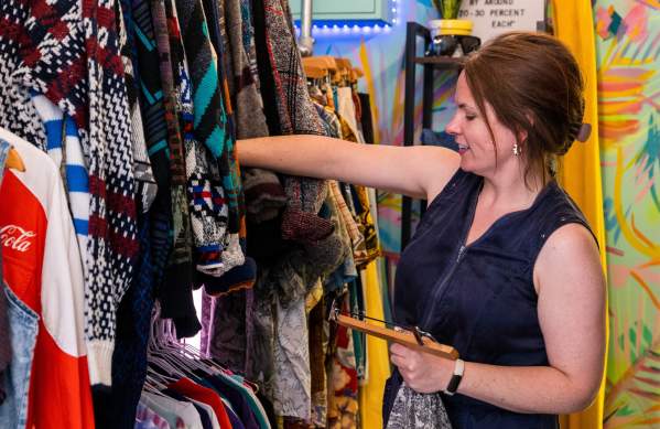A woman browsing inside the 'Something Elsie' clothing shop in Wapping Wharf on Bristol's Harbourside - credit Hey What