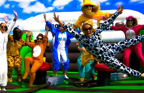 People in animal costumes jumping on bouncy castle - credit West Country Games