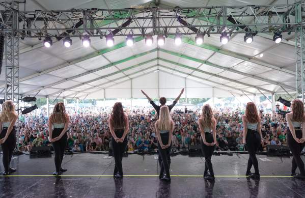 Irish dancers lined up on stage facing a crowd at the Dublin Irish Festival