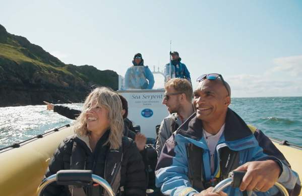 A boat full of people sightseeing