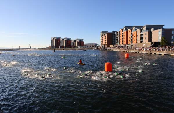 Image of people swimming on a very sunny day