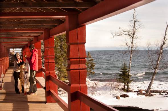 two people with snowshoes talking