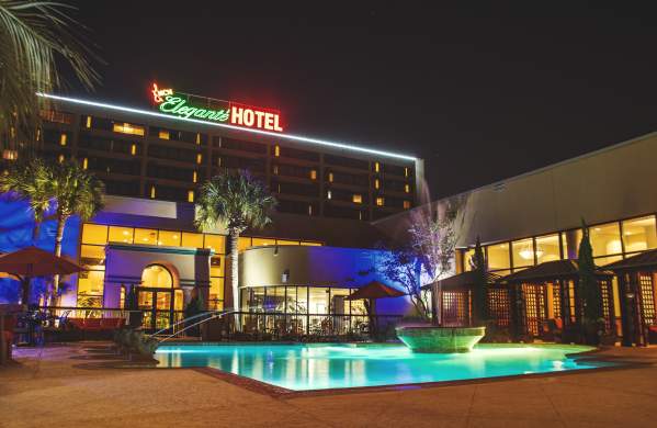 MCM Elegante hotel pool at night in Beaumont, TX