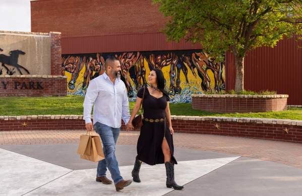 A couple walking at Pat Coursey Park