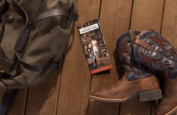 Visitor guide with bag and boots