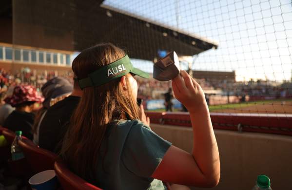 A close up of a woman's AUSL visor