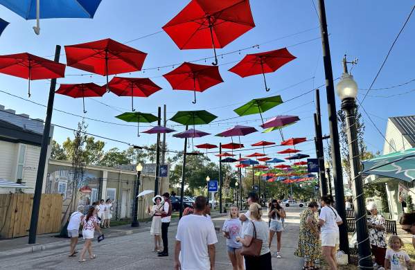 Strolling Antique Umbrella Alley at Olde Towne Slidell's annual August event, White Linen and Lagniappe