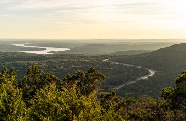 Foggy sunrise over the lush rolling hills of Balcones Canyonlands.
