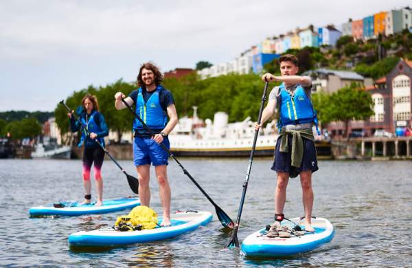 Group on paddelboards in Bristol harbour - credit SUP Bristol