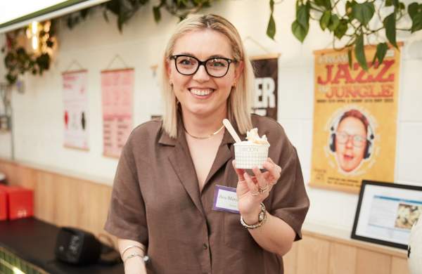 Person holding up cup of gelato - credit Charlotte Tolhurst