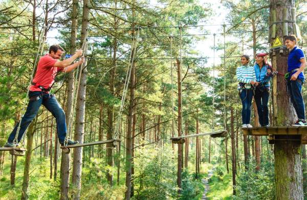 A family taking part in the Treetop Challenge at Go Ape Mallards Pike near Bristol - credit Go Ape
