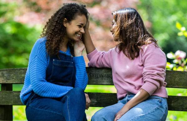 A mother and daughter sitting on a bench at Westonbirt Arboretum near Bristol - credit Johnny Hathaway