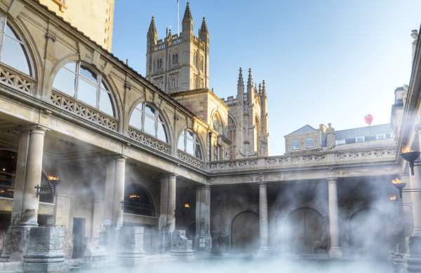 An wide shot of the Great Bath at The Roman Baths in central Bath, near Bristol